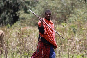 A Masai boy showing how to hold a spear correctly. 